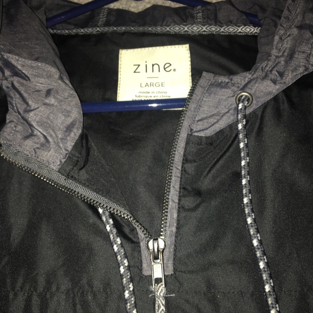 black and grey large zine half zip wind breaker